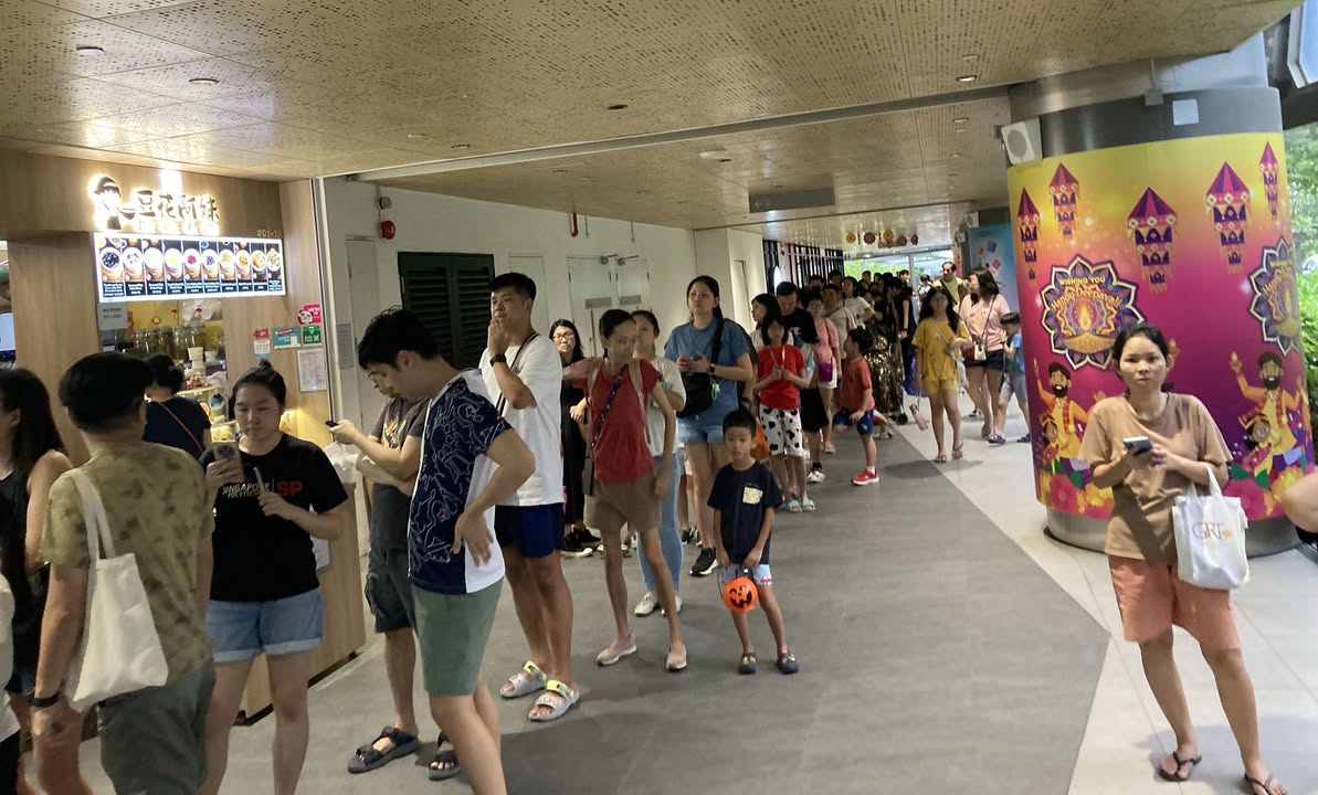Families and friends celebrating Halloween at Anchorvale Village event