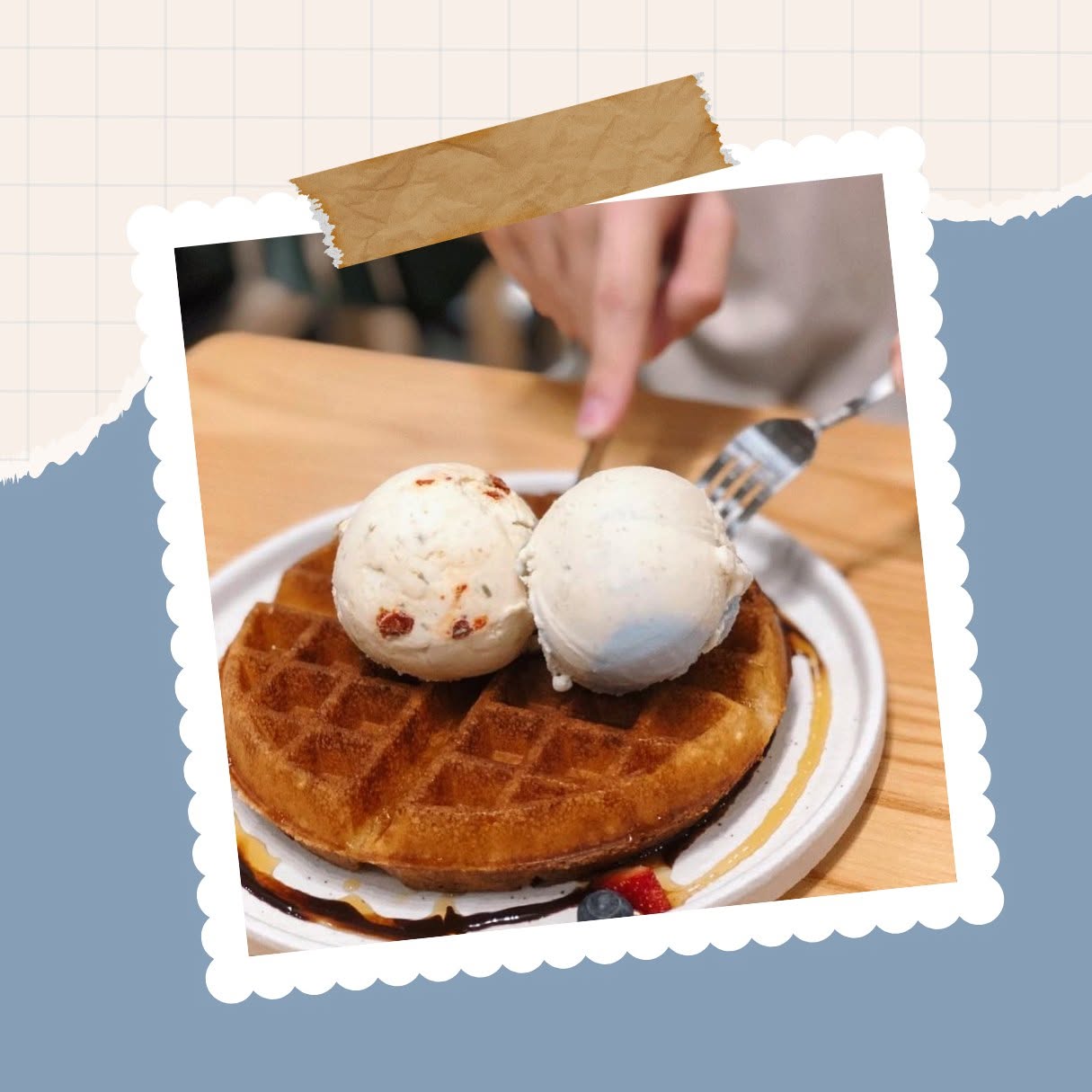 Waffle with ice cream topped with berries and syrup