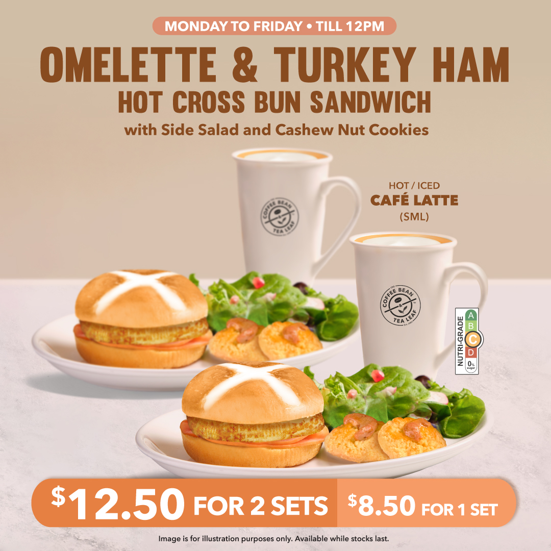 A delicious Omelette and Turkey Ham Hot Cross Bun Sandwich served with salad, cookies, and a latte