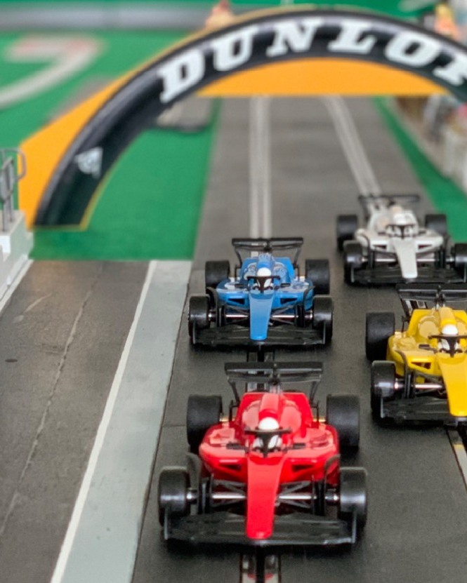 Promotional image for the F1 Mini Car Race and Live Screening event.